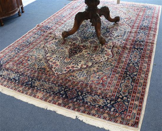 A cream ground rug, 9ft 8in. x 6ft 2in.